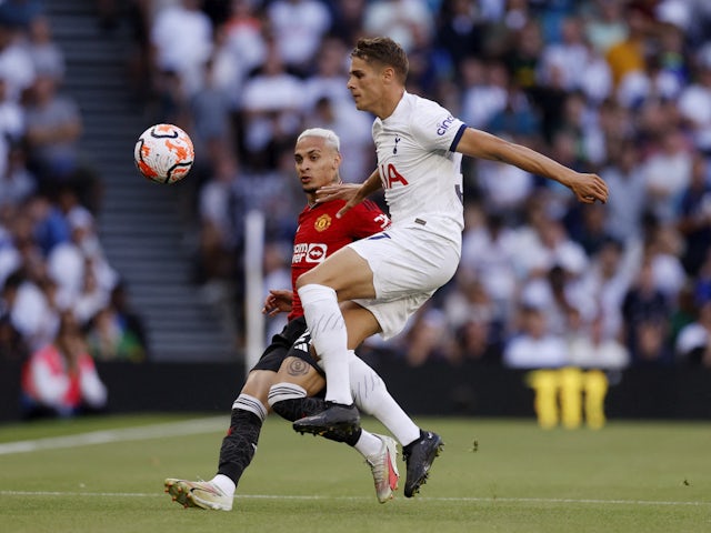 Manchester United's Antony in action with Tottenham Hotspur's Micky van de Ven on August 19, 2023