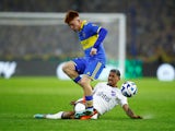 Boca Juniors' Valentin Barco in action with Nacional's Yonatan Rodriguez on August 9, 2023