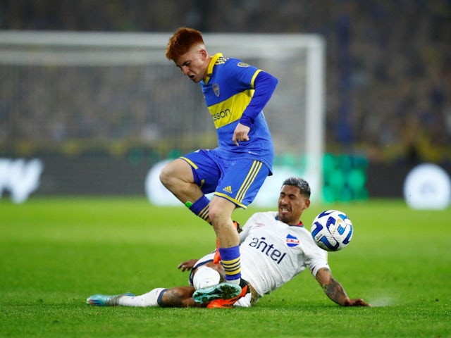 Boca Juniors' Valentin Barco in action with Nacional's Yonatan Rodriguez on August 9, 2023