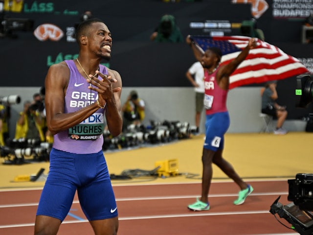 Zharnel Hughes celebrates bronze in the 100m at World Athletics Championship on August 20, 2023.