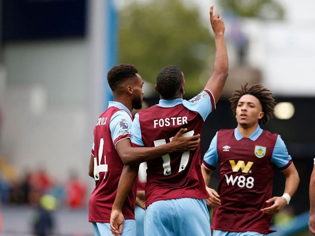 Burnley's Lyle Foster scores celebrates scoring their first goal with teammates Hannes Delcroix and Luca Koleosho on August 27, 2023