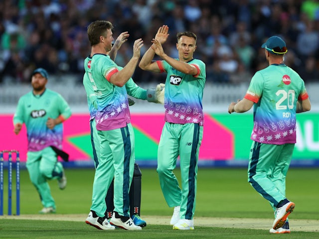 Oval Invincibles' Tom Curran celebrates with teammates after taking the wicket of Manchester Originals' Philip Salt  on August 27, 2023