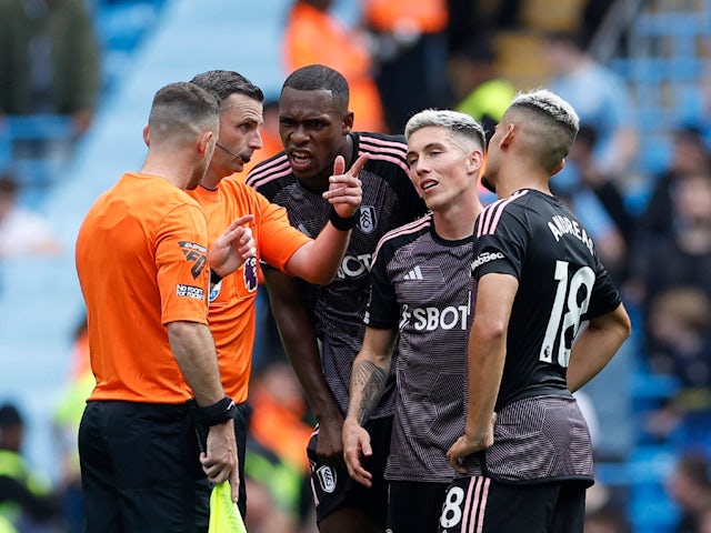 Fulham players remonstrate with referee Michael Oliver on September 2, 2023