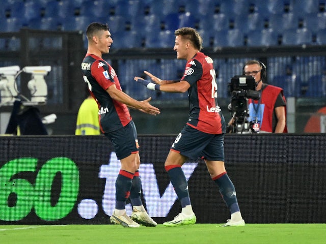 Genoa's Mateo Retegui celebrates scoring their first goal with Ruslan Malinovskyi on August 27, 2023