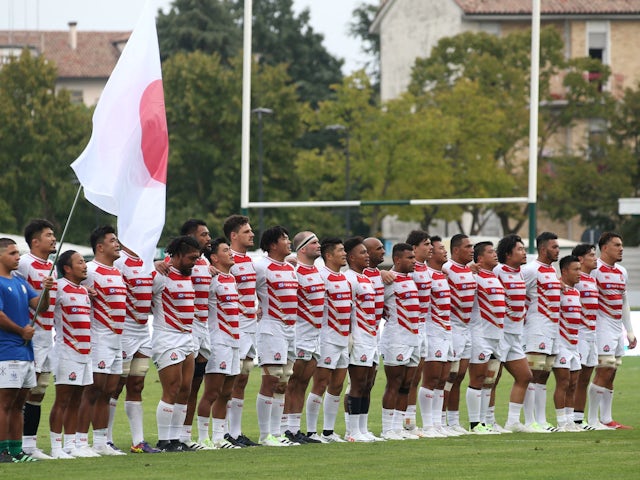Japan players line up during the national anthems before the match on August 26, 2023