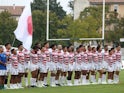 Japan players line up during the national anthems before the match on August 26, 2023