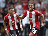 Sheffield United's Cameron Archer and Gustavo Hamer celebrate after Everton's Jordan Pickford scores an own goal and Sheffield United's second on September 2, 2023