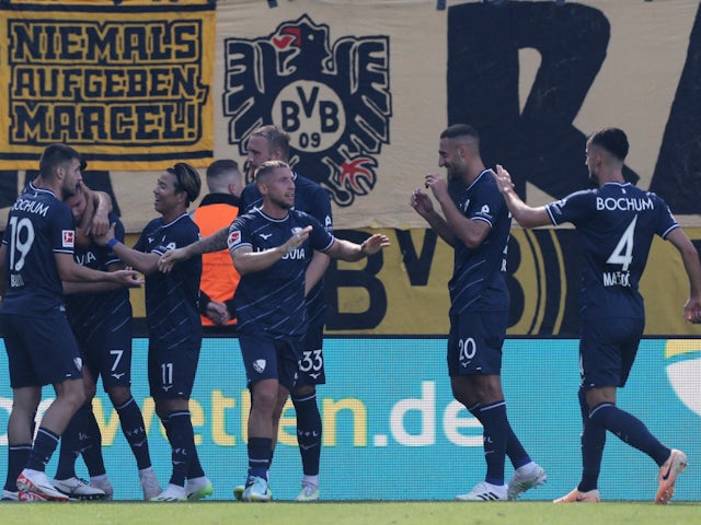 VfL Bochum's Kevin Stoger celebrates scoring their first goal with teammates on August 26, 2023
