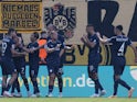 VfL Bochum's Kevin Stoger celebrates scoring their first goal with teammates on August 26, 2023