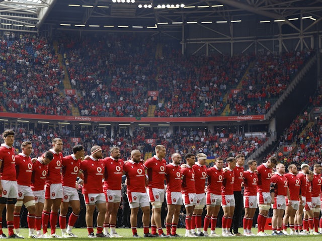 Wales rugby players line up before the match on August 19, 2023