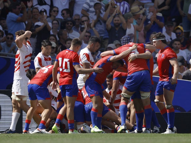 Chile's Alfonso Escobar celebrates scoring their second try with teammates on September 10, 2023