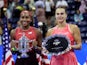 Coco Gauff of the U.S. celebrates with the trophy and second place Belarus' Aryna Sabalenka after winning the U.S. Open on September 9, 2023