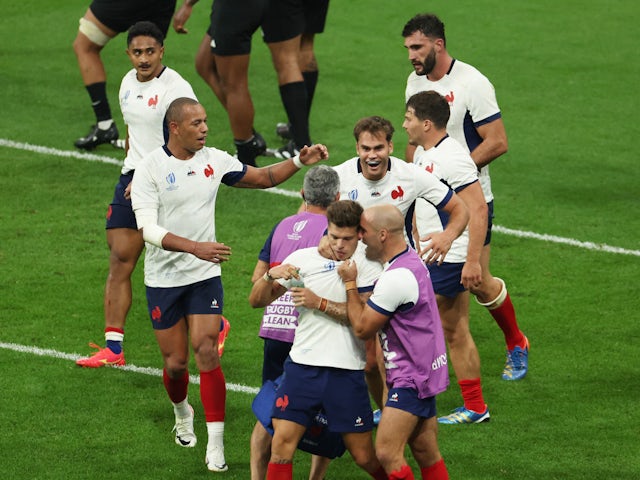  France's Damian Penaud celebrates scoring their first try with Gael Fickou and teammates on September 8, 2023