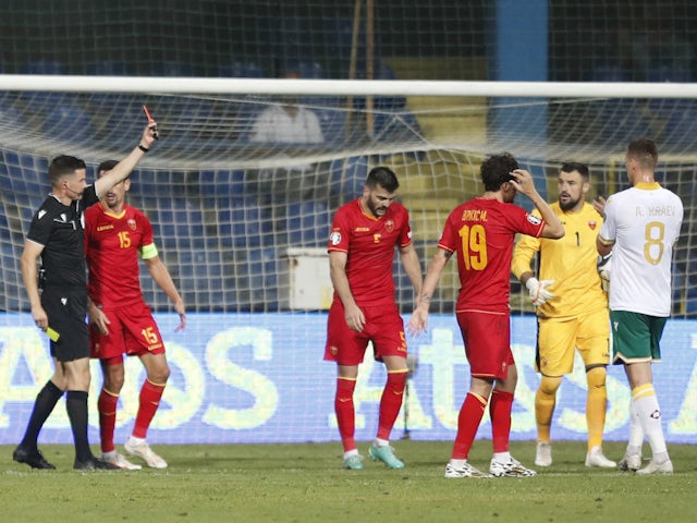 Montenegro's Igor Vujacic is shown a red card by referee Harm Osmers on September 10, 2023