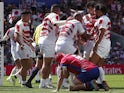 Japan's Michael Leitch celebrates scoring their fourth try with teammates on September 9, 2023