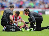 Sheffield United's John Egan receives medical attention on September 2, 2023