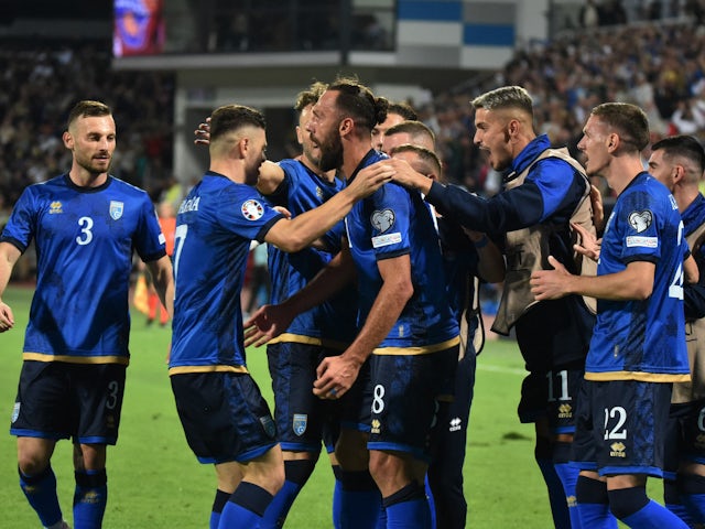 Kosovo's Vedat Muriqi celebrates scoring their first goal with teammates on September 9, 2023