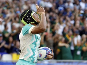 South Africa overcome Scotland to begin World Cup defence with win