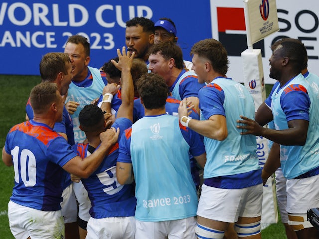 Namibia's Gerswin Mouton celebrates scoring their first try with teammates on September 9, 2023