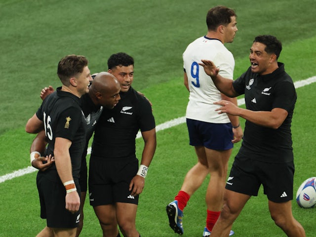 New Zealand's Mark Telea celebrates scoring their second try with teammates on September 8, 2023