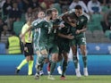 Northern Ireland's Jonny Evans celebrates scoring their second goal with teammates on September 7, 2023