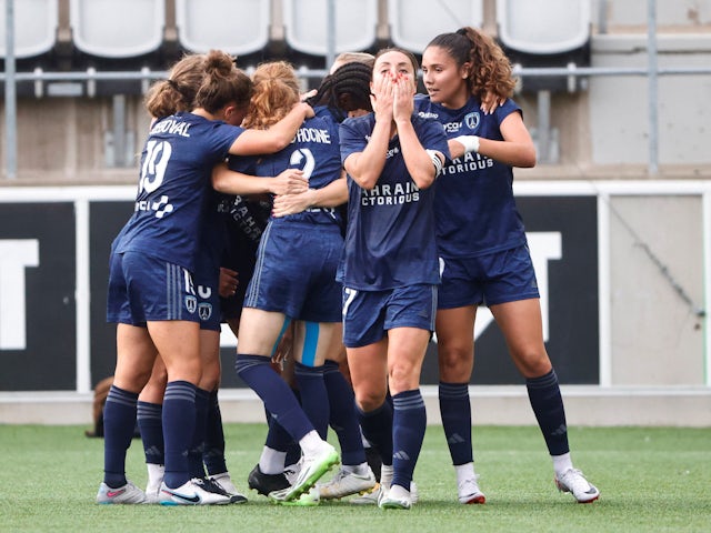 Paris FC Women's Louise Fleury celebrates scoring their third goal with teammates on September 9, 2023