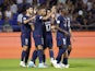 Paris Saint-Germain (PSG)'s Marco Asensio celebrates scoring their third goal with Kylian Mbappe on September 3, 2023