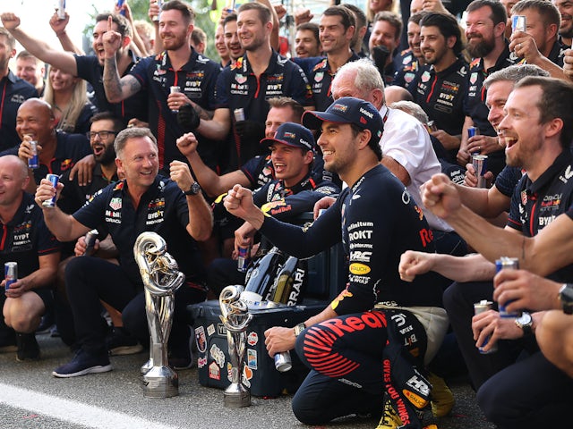 Red Bull's Max Verstappen celebrates winning the race with Red Bull team principal Christian Horner, Red Bull's Sergio Perez and team on September 3, 2023