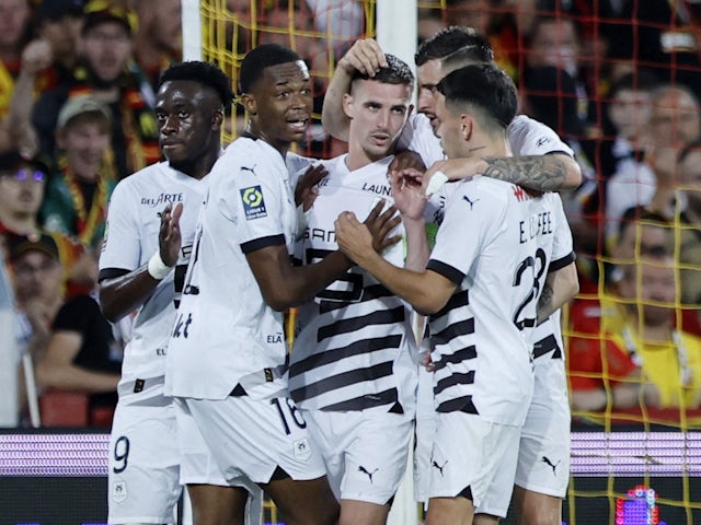 Rennes' Benjamin Bourigeaud celebrates scoring their first goal with teammates on August 20, 2023
