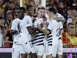 Rennes' Benjamin Bourigeaud celebrates scoring their first goal with teammates on August 20, 2023