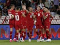 Serbia players celebrate after Hungary's Attila Szalai scores an own goal and Serbia's first on September 7, 2023