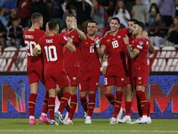 Serbia players celebrate after Hungary's Attila Szalai scores an own goal and Serbia's first on September 7, 2023
