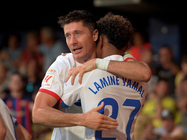 Barcelona's Robert Lewandowski celebrates scoring with Lamine Yamal on August 27, 2023