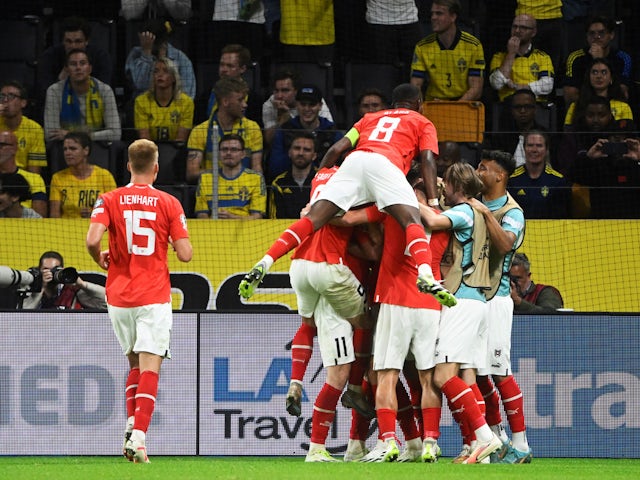 Austria's Michael Gregoritsch celebrates scoring their first goal with teammates on September 12, 2023