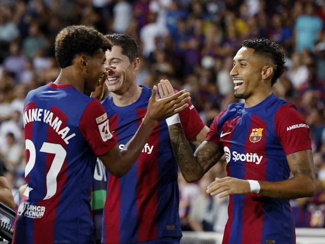 Barcelona's Raphinha celebrates scoring against Real Betis on September 16, 2023