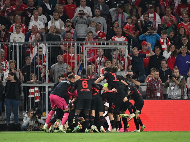 Bayer Leverkusen's Exequiel Palacios celebrates scoring their second goal with teammates on September 15, 2023