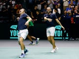 Britain's Neal Skupski and Dan Evans celebrate after winning their doubles match against France's Nicolas Mahut and Edouard Roger-Vasselin on September 17, 2023