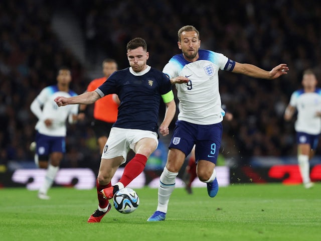 England's Harry Kane in action with Scotland's Andrew Robertson on September 12, 2023