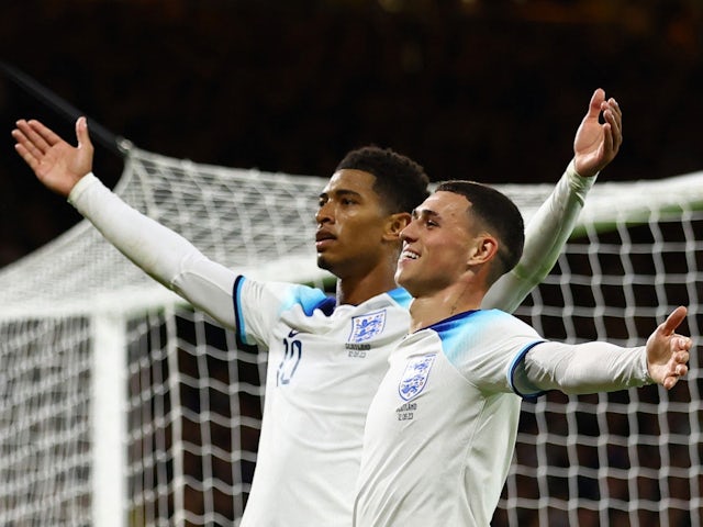 England's Jude Bellingham celebrates scoring their second goal with Phil Foden on September 12, 2023