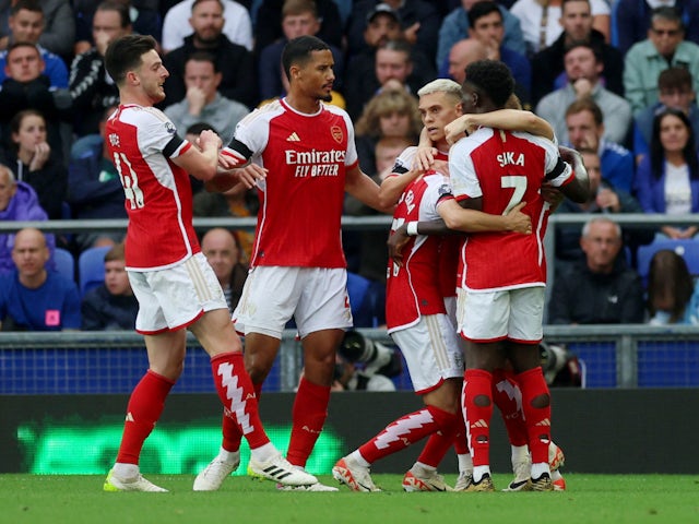 Arsenal's Leandro Trossard celebrates scoring their first goal with teammates on September 17, 2023