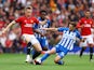 Manchester United's Scott McTominay in action with Brighton & Hove Albion's Adam Lallana on September 16, 2023