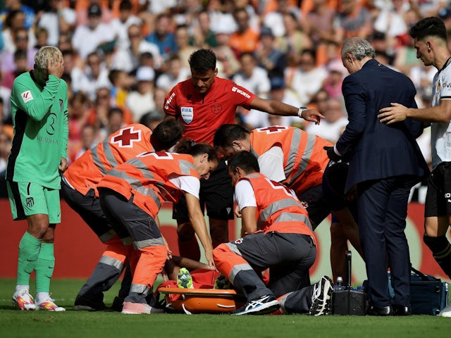 Atletico Madrid's Thomas Lemar is placed on a stretcher after sustaining an injury on September 16, 2023