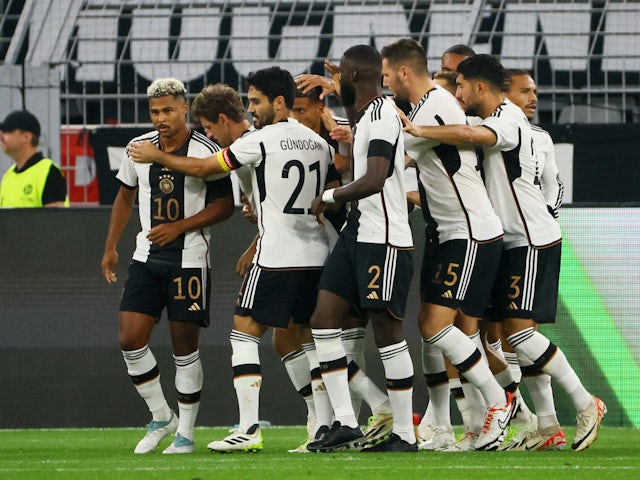 Germany's Thomas Muller celebrates scoring their first goal with teammates on September 12, 2023