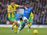 Chesterfield's Tim Akinola in action with West Bromwich Albion's Martin Kelly in January 2023