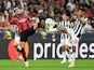 AC Milan's Olivier Giroud in action with Newcastle United's Bruno Guimaraes on September 19, 2023