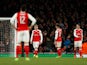 Arsenal's David Ospina, Nacho Monreal and Granit Xhaka look dejected after Bayern Munich's Arjen Robben scores their second goal on March 7, 2017