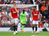 Manchester United's Bruno Fernandes and Scott McTominay look dejected after Brighton & Hove Albion's first goal on September 16, 2023