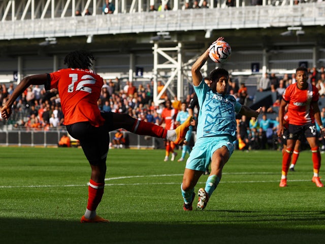Wolverhampton Wanderers midfielder Joao Gomes concedes a penalty against Luton Town on September 23, 2023.