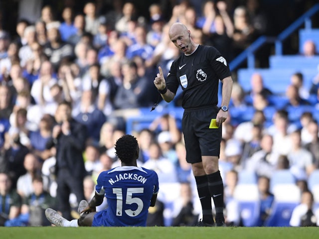 Chelsea forward Nicolas Jackson receiving a yellow card against Liverpool on August 12, 2023.