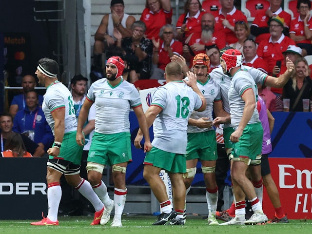 Portugal's Nicolas Martins celebrates scoring their first try with teammates on September 16, 2023